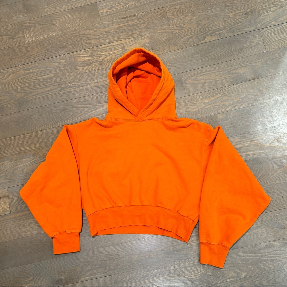 Aritzia TNA Orange Cozy Fleece Perfect Shrunken Hoodie.